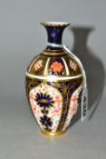 A ROYAL CROWN DERBY IMARI SMALL BALUSTER VASE, decorated in the 1128 pattern, date cypher for