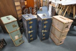 TWO VINTAGE BLUE FINISH TRAVELLING TRUNKS, and two canvas and beech banded trunks (condition:-all