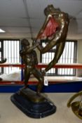 A MODERN BRONZE SCULPTURE, of a man and woman, the male dancer is hoisting the woman in the air,