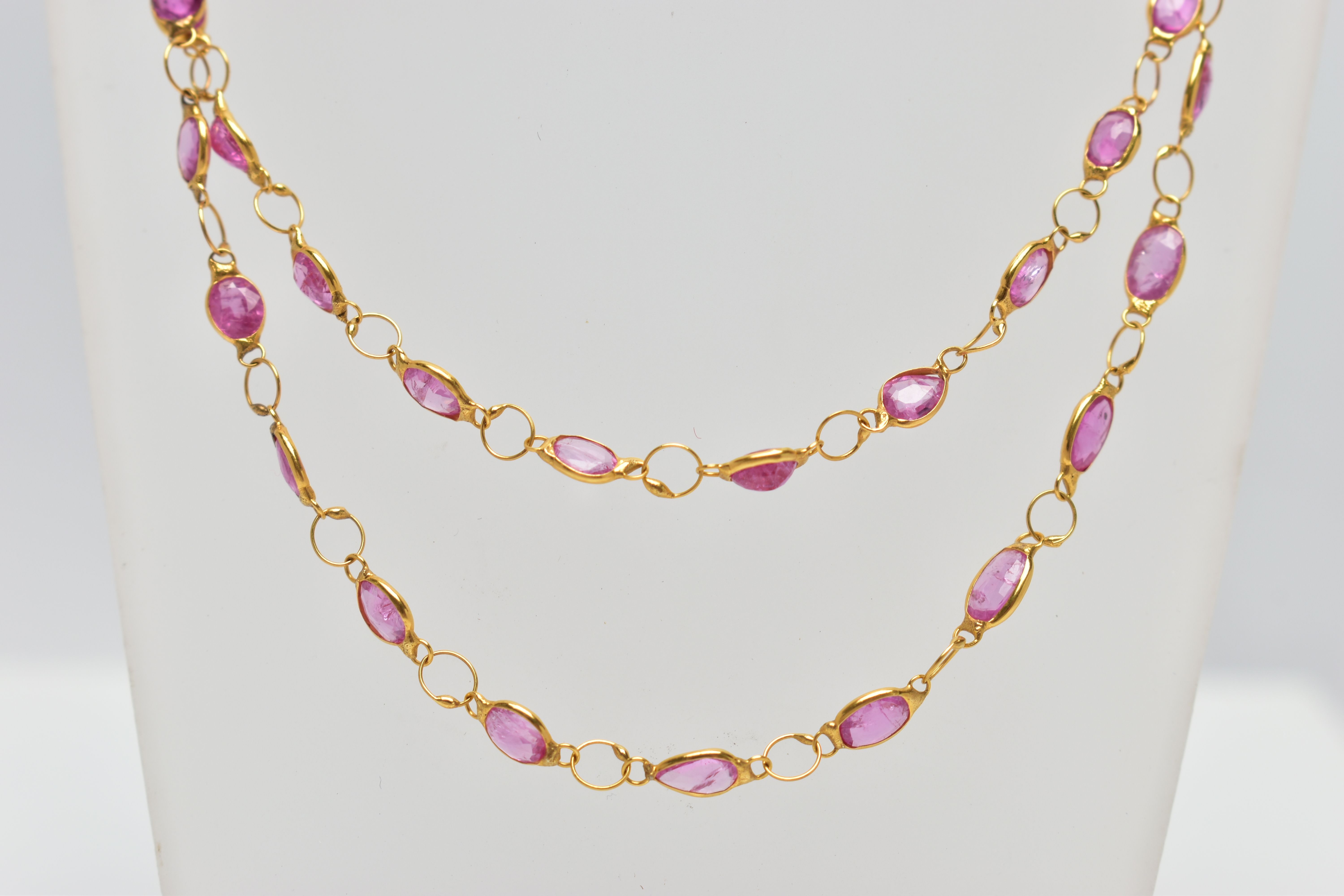 A YELLOW METAL, SAPPHIRE SPECTACLE SET NECKLACE, comprised of forty three mixed cut pink - Image 3 of 3