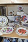 A GROUP OF COLLECTORS PLATES, thirty two plates, nine boxed, with themes to include dogs, flowers