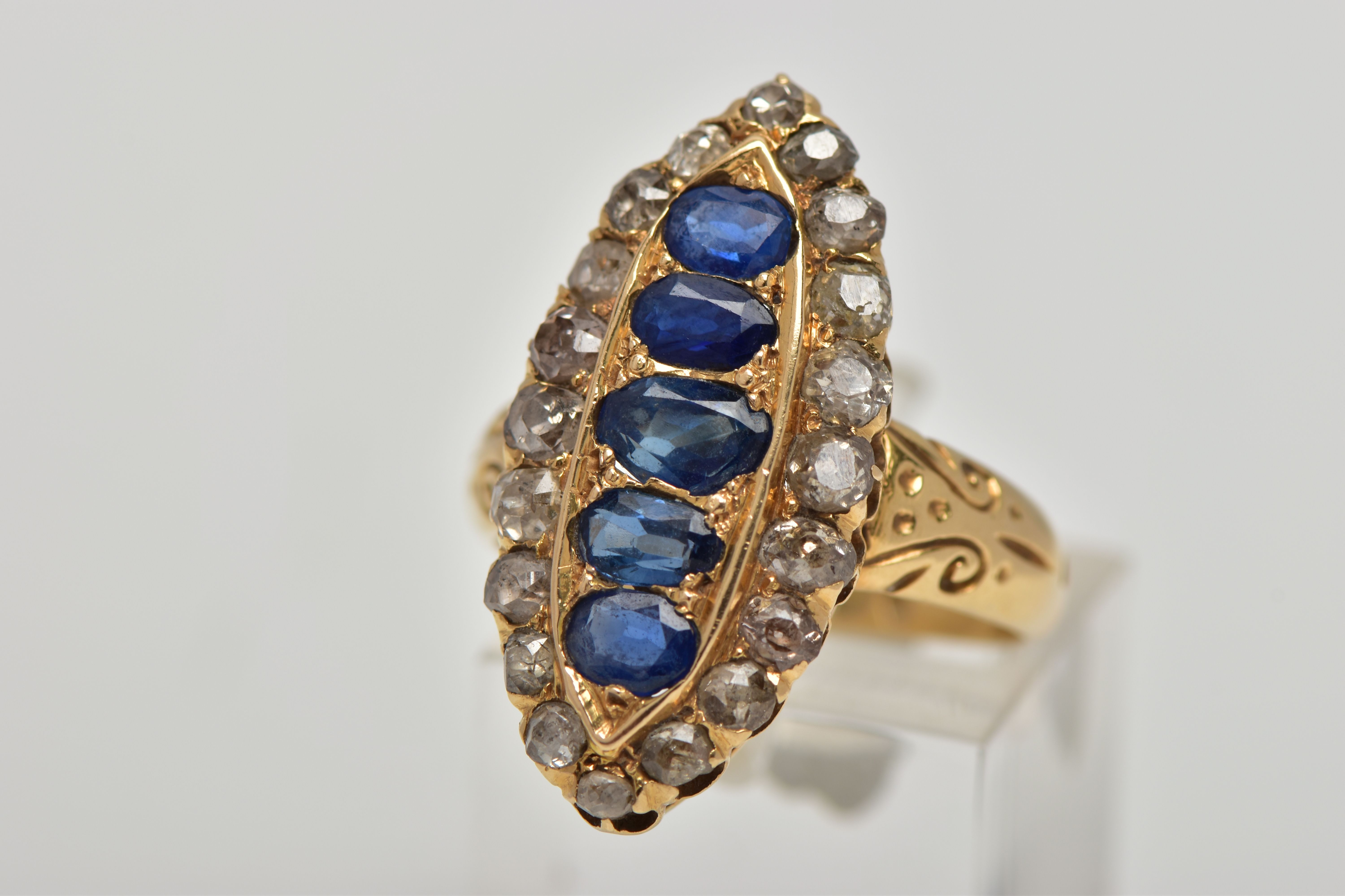 AN 18CT GOLD, LATE VICTORIAN SAPPHIRE AND DIAMOND RING, of a large marquise form set centrally