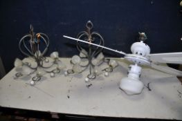 TWO METAL CHANDELLIER with glass bell shaped wax inserts along with a unbranded ceiling fan and