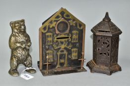THREE LATE VICTORIAN AND 20TH CENTURY METAL MONEY BOXES / BANKS, comprising a cast metal and