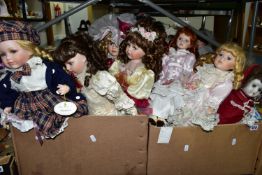 A QUANTITY OF COLLECTABLE PORCELAIN DOLLS, to include over thirty dolls, some on stands, Angelic '