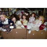 A QUANTITY OF COLLECTABLE PORCELAIN DOLLS, to include over thirty dolls, some on stands, Angelic '