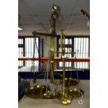 TWO SETS OF VICTORIAN BRASS SCALES, comprising one set with chains and pans on a brass stand, height