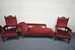 AN EDWARDIAN WALNUT SEVEN PIECE PARLOUR SUITE, covered with red upholstery, comprising a chaise