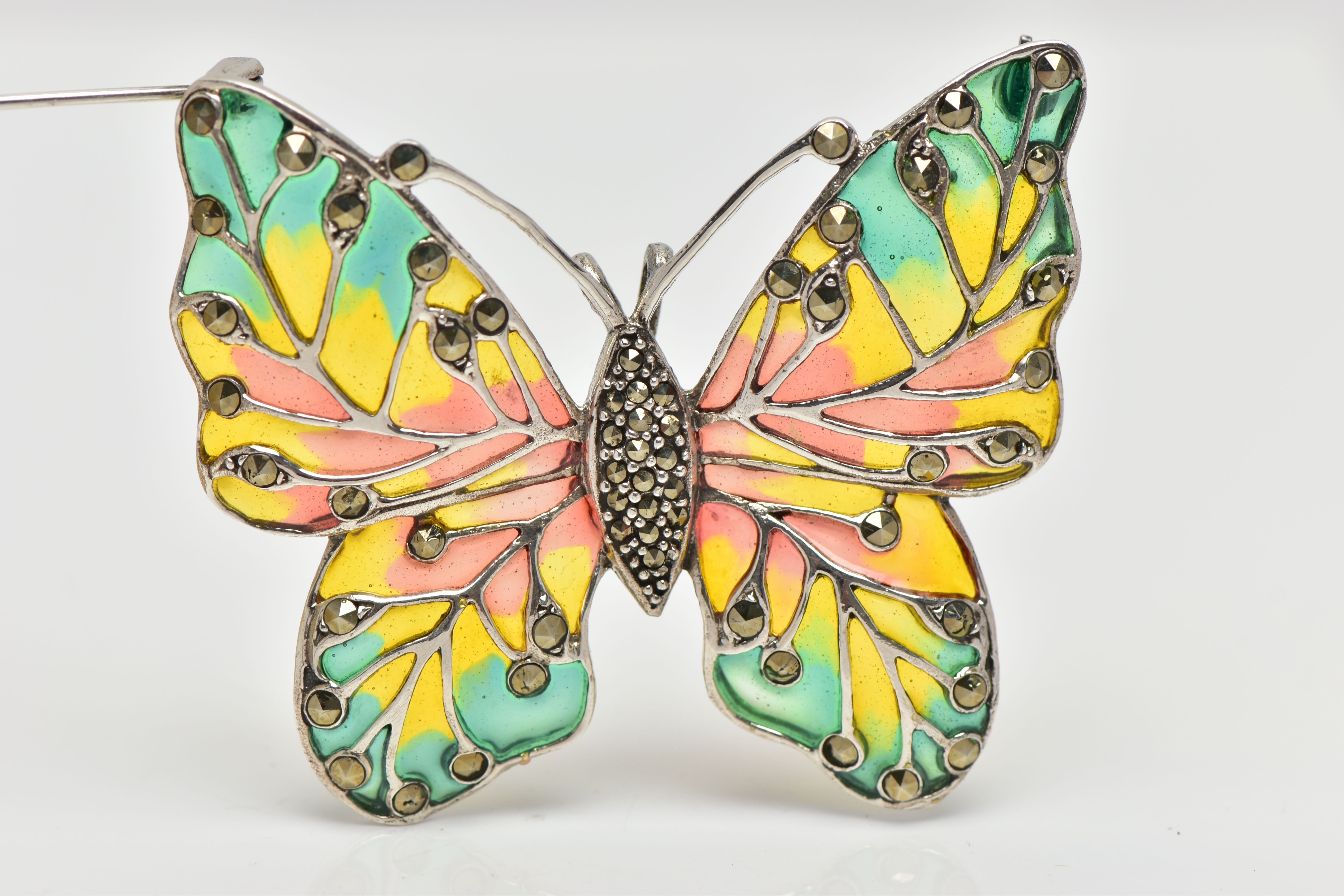 A PLIQUE A JOUR AND MARCASTITE BUTTERFLY BROOCH, the butterfly with marcasite set body and