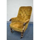 A VICTORIAN WALNUT ARMCHAIR, on turned front legs, and brass casters (condition:-rickety frame)