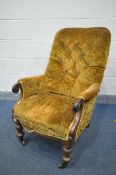 A VICTORIAN WALNUT ARMCHAIR, on turned front legs, and brass casters (condition:-rickety frame)