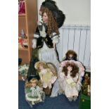 FIVE BISQUE HEAD COLLECTORS DOLLS, comprising a 100cm doll with supporting stand, an Alberon doll '