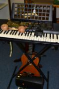 A YAMAHA PSR225 ELECTRONIC ORGAN WITH STAND, together with a pair of Columbian maracas, a