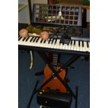 A YAMAHA PSR225 ELECTRONIC ORGAN WITH STAND, together with a pair of Columbian maracas, a