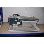 A PERFORMANCE POWER PPRTC600 TILE CUTTER with blade along with a B&Q bridge saw tile cutter with