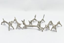 SEVEN WHITE METAL NOVELTY KNIFE RESTS, depicting various animals to include a hare, dog and fox,