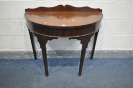 A GEORGIAN MAHOGANY DEMI LUNE HALL TABLE, with a wavy raised back, on square tapered legs, width