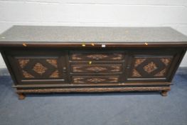 A 20TH CENTURY THAI ORIENTAL HEAVILY CARVED STAINED TEAK SIDEBOARD, the recessed top with a