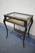 AN EDWARDIAN MAHOGANY BIJOUTERIE CABINET, on cabriole legs, united by a stretcher and undershelf,