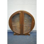 A 1930'S ART DECO DISPLAY CABINET, with geometric glazed doors, on two half round feet, width