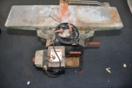 A DeWALT DW1150 THICKNESSER-PLANER, on metal stand with undershelf (some rust) (UNTESTED)