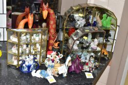 A GROUP OF COLLECTABLE CAT ORNAMENTS, comprising two glass display cabinets with twenty seven