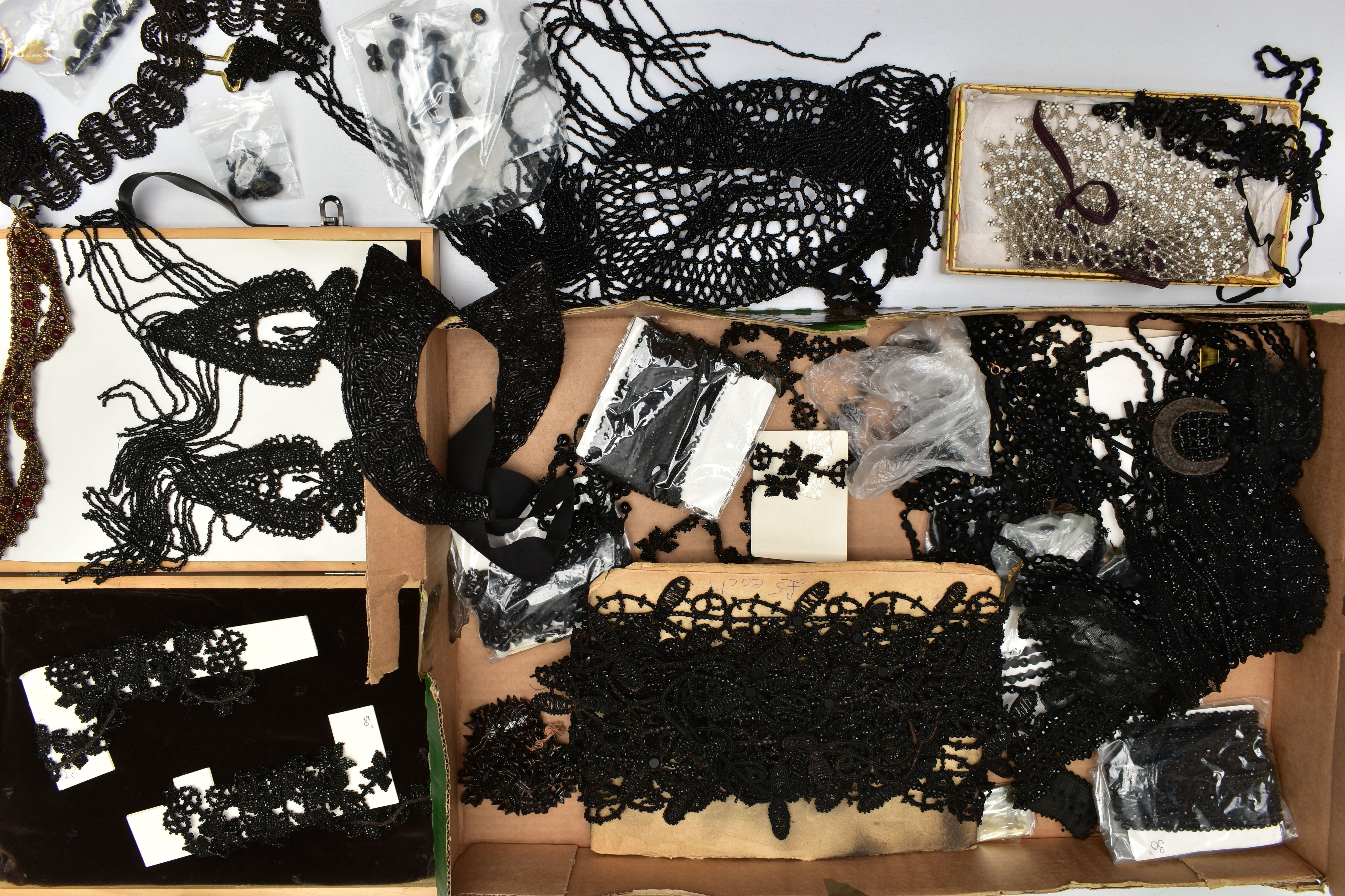 A BOX OF HABERDASHERY ACCESSORIES AND COSTUME JEWELLERY, to include a black beaded flapper girl head