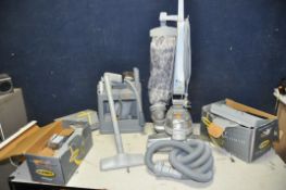 A KIRBY G7E ULTIMATE VACUUM CLEANER along with a large selection of accessories and attachments (PAT
