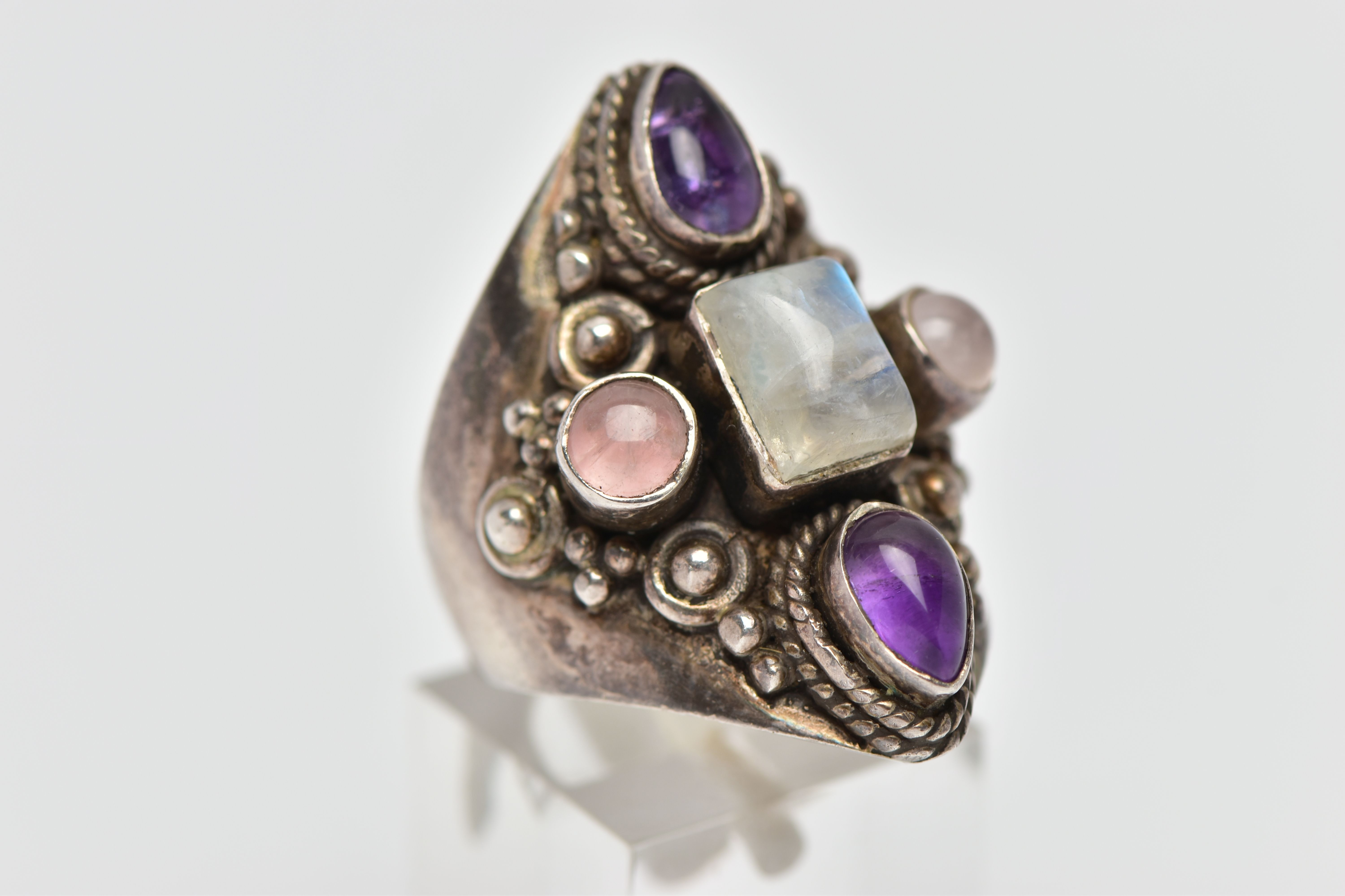 A GEM SET RING, a white metal dress ring, set with a cabochon moonstone centre stone, with - Image 4 of 4