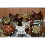 TWELVE STUDIO POTTERY CAT WALL MASKS, in a variety of coloured glazes, sizes and styles, all