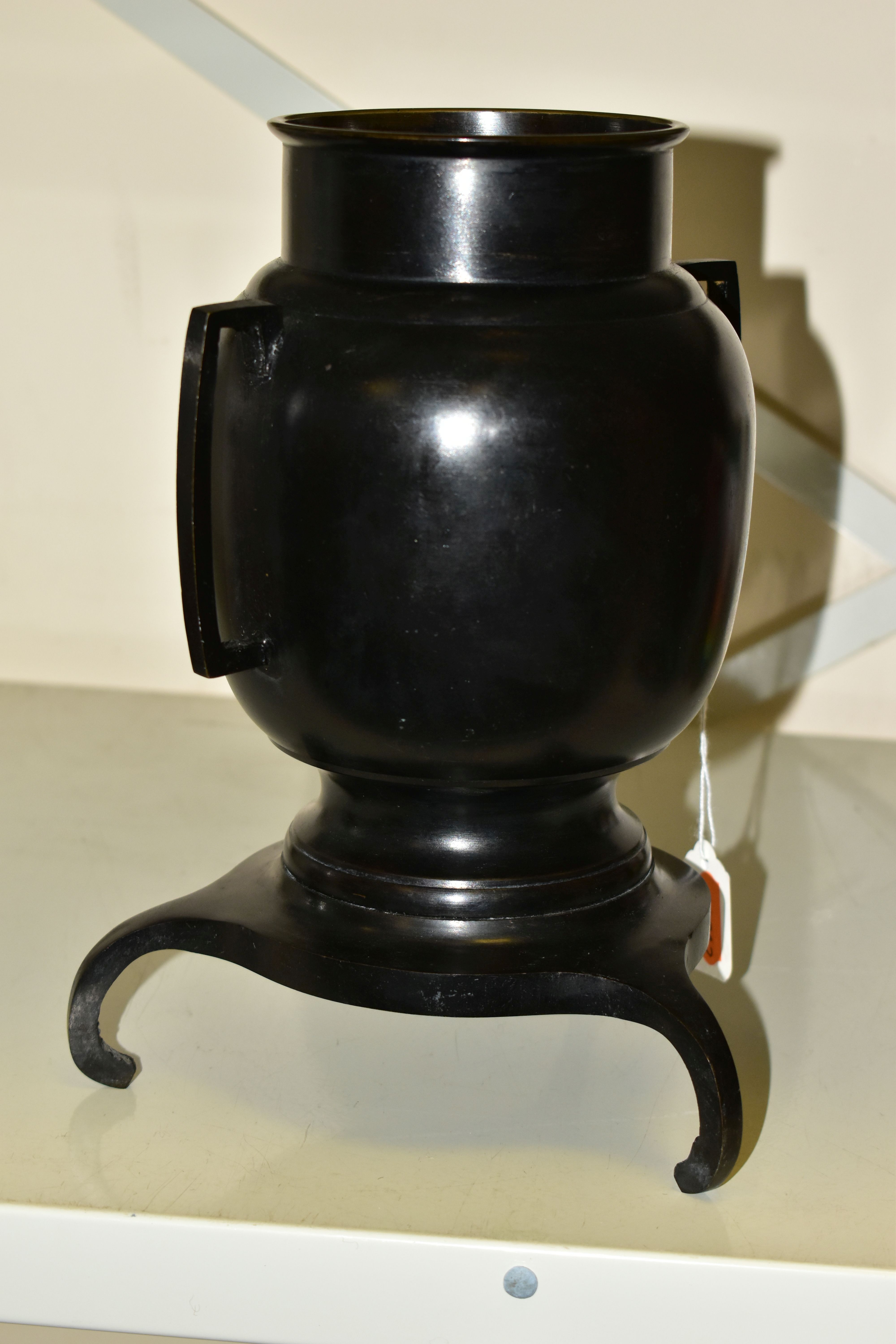 A BRONZED JAPANESE STYLE VASE, of bulbous form with geometric handles, supported on its base by - Image 3 of 5