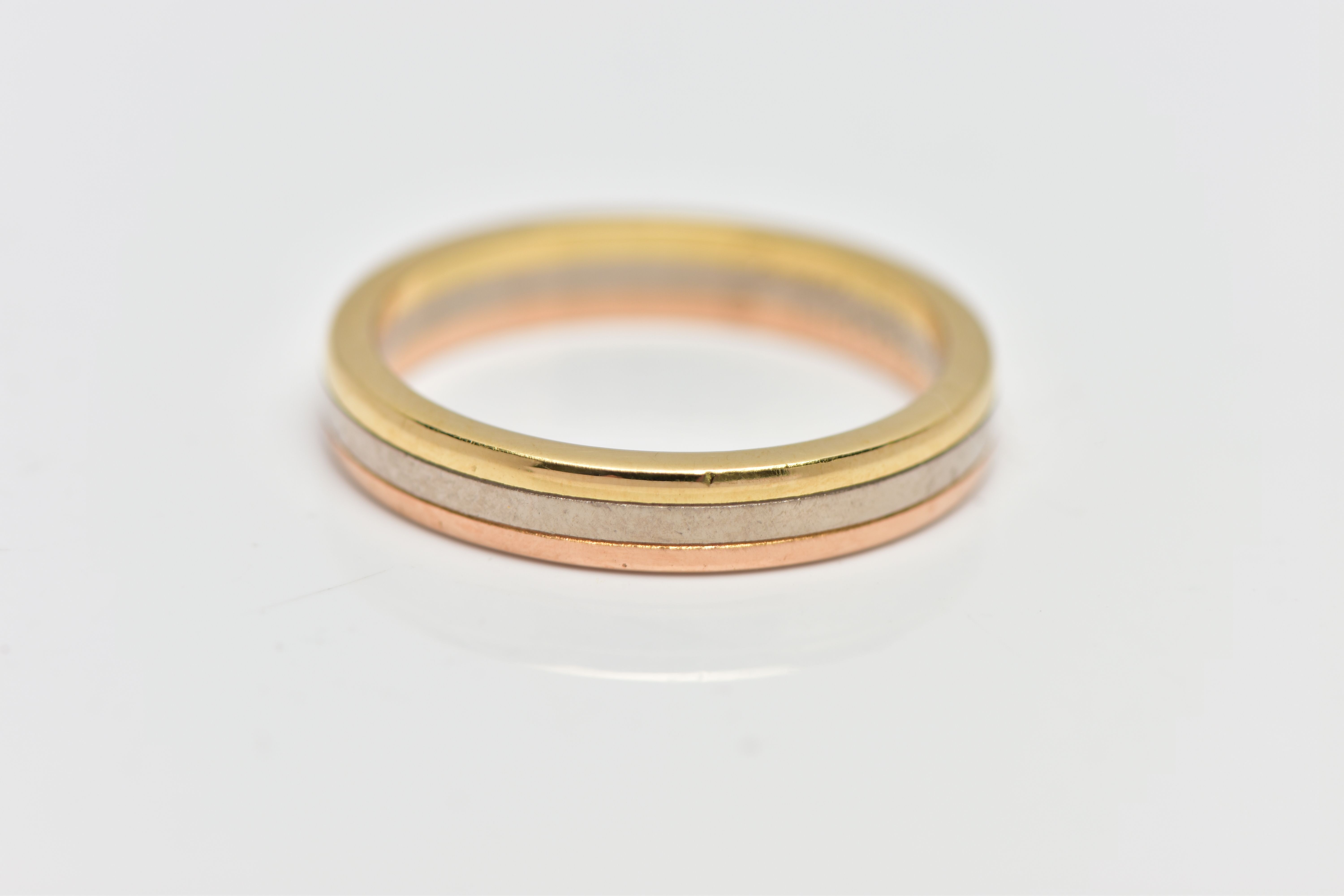 A CARTIER 'TRINITY' RING, designed as a yellow, white and rose plain polished band, signed and - Image 2 of 2