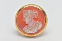 A YELLOW METAL CAMEO BROOCH, carved sardonyx of a circular form, depicting a lady in profile, within