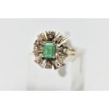 A 1970s EMERALD AND DIAMOND CLUSTER RING, of geometric design, set with a principal rectangular