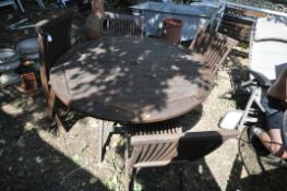 A STAINED TEAK FOLDING GARDEN TABLE, diameter 120cm x height 75cm, and four folding chairs (