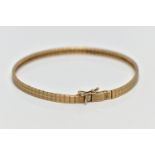 A 9CT GOLD BRACELET, a yellow gold bracelet comprised of a series of rectangular textured links with