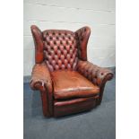 A BUTTONED OXBLOOD LEATHER ARMCHAIR, width 100cm x depth 106cm x height 104cm (condition:-torn