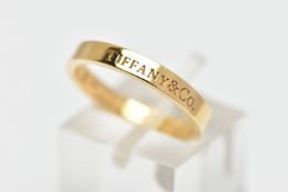 A 'TIFFANY & CO.,' BAND RING, signed Tiffany & Co., stamped Au750, ring size L 1/2, approximate