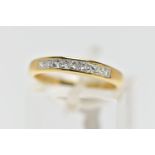 AN 18CT GOLD DIAMOND NINE STONE RING, channel set with graduated princess cut diamonds to the