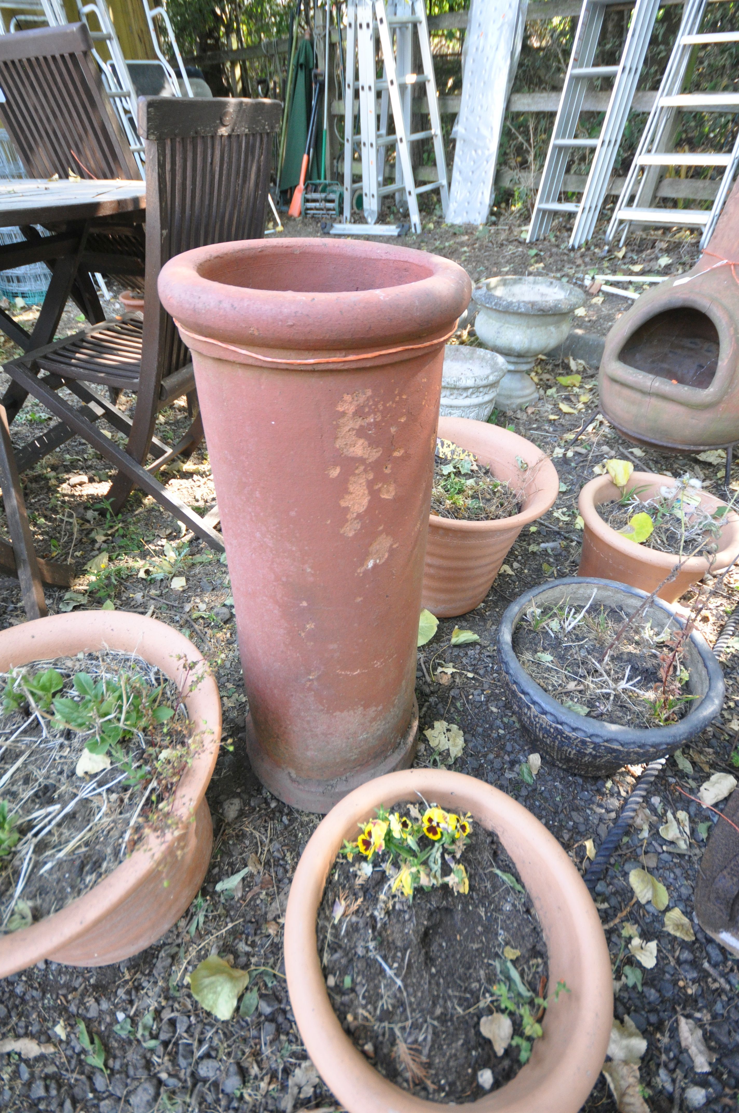 A CYLINDRICAL TERRACOTTA CHIMNEY POT, diameter 29cm x height 77cm, along with a pair of terracotta - Image 2 of 3