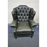 A GREEN LEATHER BUTTONED CHESTERFIELD ARMCHAIR, on front cabriole legs, width 83cm x depth 77cm x