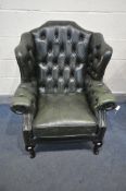 A GREEN LEATHER BUTTONED CHESTERFIELD ARMCHAIR, on front cabriole legs, width 83cm x depth 77cm x