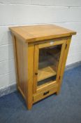 A MODERN SOLID OAK MEDIA CABINET, width 66cm x depth 47cm x height 107cm (condition - stain to top)