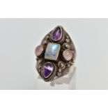 A GEM SET RING, a white metal dress ring, set with a cabochon moonstone centre stone, with
