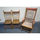 AN EDWARDIAN AMERCIAN ROCKING CHAIR, along with a pair of elm and beech spindle back chair (
