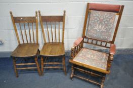 AN EDWARDIAN AMERCIAN ROCKING CHAIR, along with a pair of elm and beech spindle back chair (