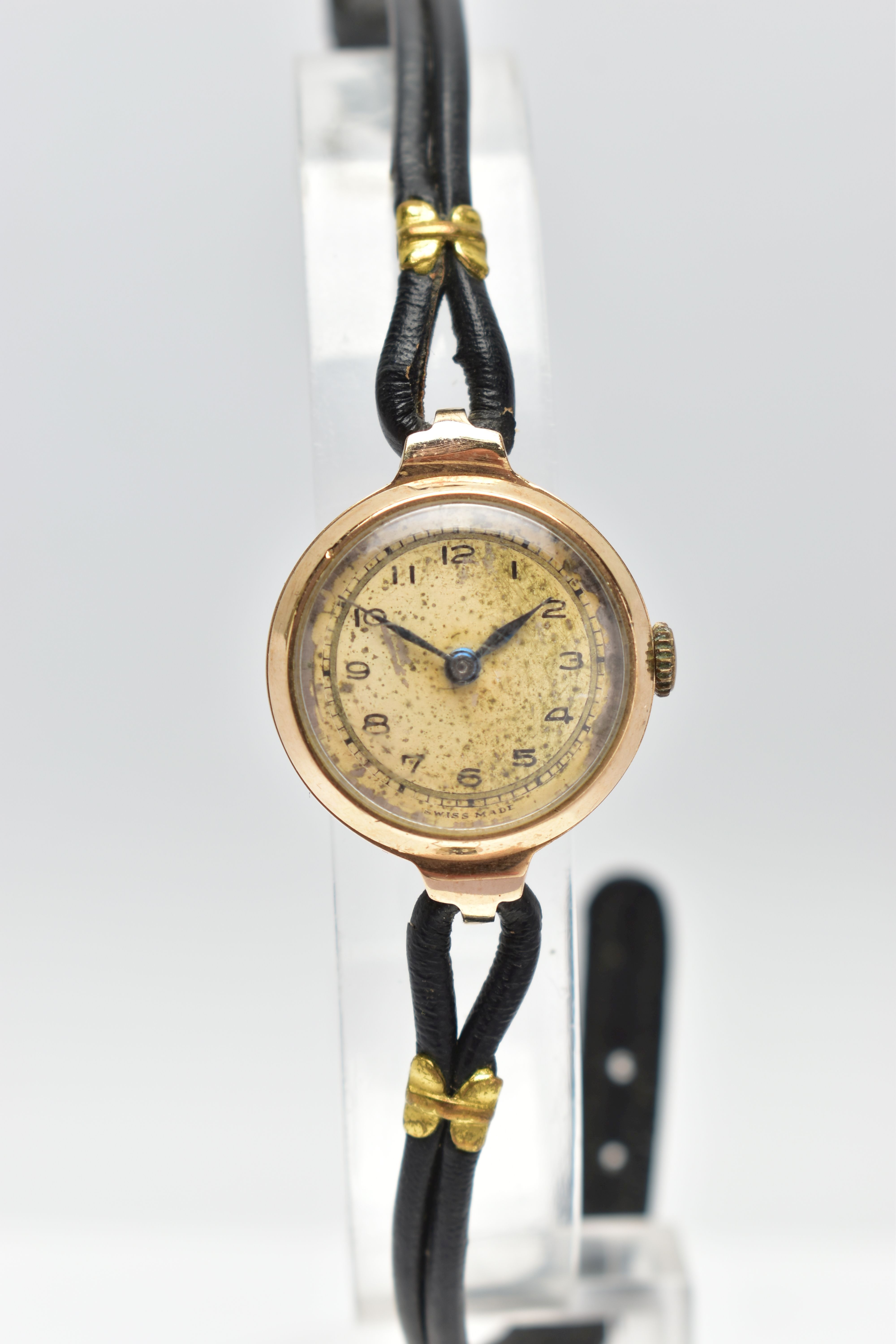 A 1940s 9CT YELLOW GOLD MANUAL WIND WRISTWATCH, the circular gold tone dial, with black Arabic