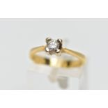 A YELLOW METAL DIAMOND SINGLE STONE RING, designed as a brilliant cut diamond within a four claw