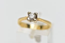 A YELLOW METAL DIAMOND SINGLE STONE RING, designed as a brilliant cut diamond within a four claw