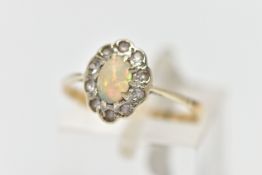 A MID 20TH CENTURY OPAL CLUSTER RING, set with a principal oval opal cabochon, within a colourless